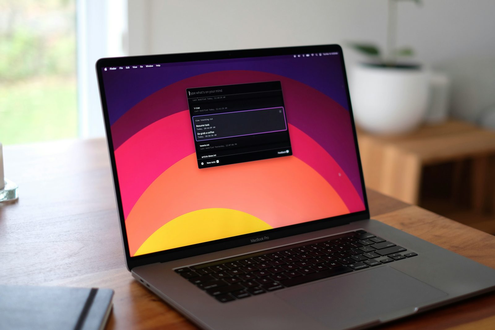 Refurbished laptop set up on a wooden desk