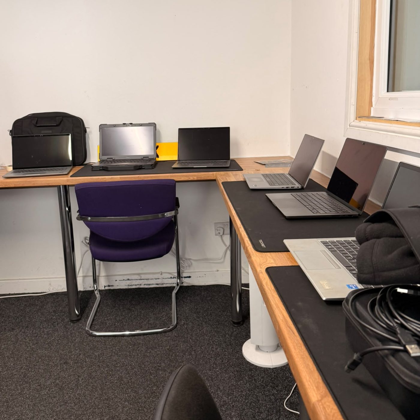 Laptops being tested on the benches at our processing facility